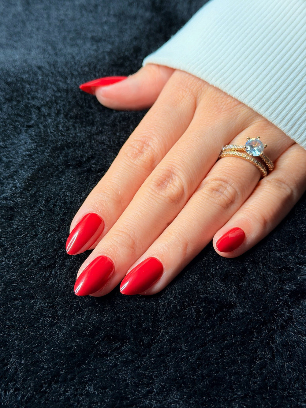 Close-up of Scarlett cherry red almond press on nails