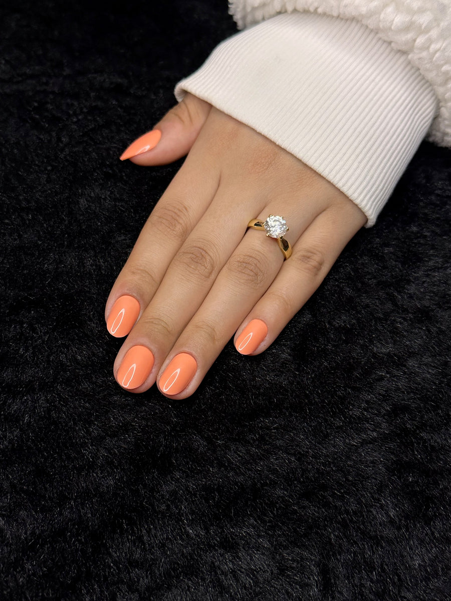 Close-up of Estelle coral round press on nails