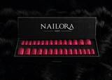 Close-up of Léonie deep magenta glitter round press on nails