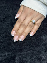 Close-up of Romane french tip almond press on nails