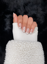 Valentine pearl french tip almond press on nails hand pose – Nailora Paris