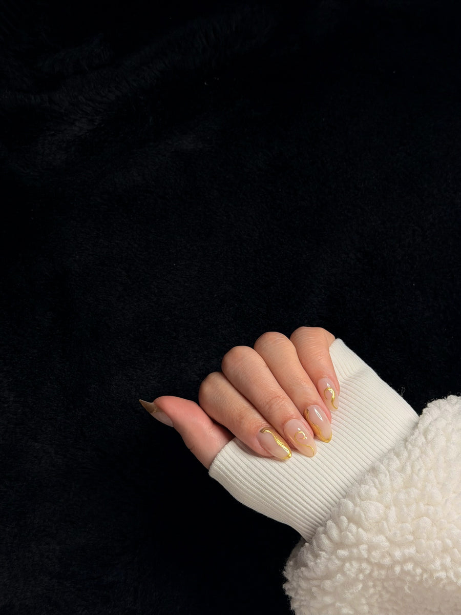 Nailora Paris — Octavie — Medium Almond Nude Gold Swirls press-on nails — detail