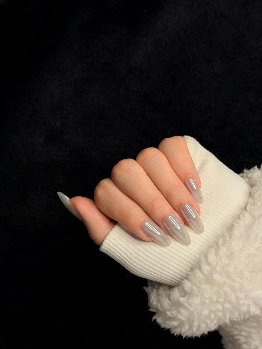 Nailora Paris — Honorine — Long Almond Nude White Swirls press-on nails — closed hand
