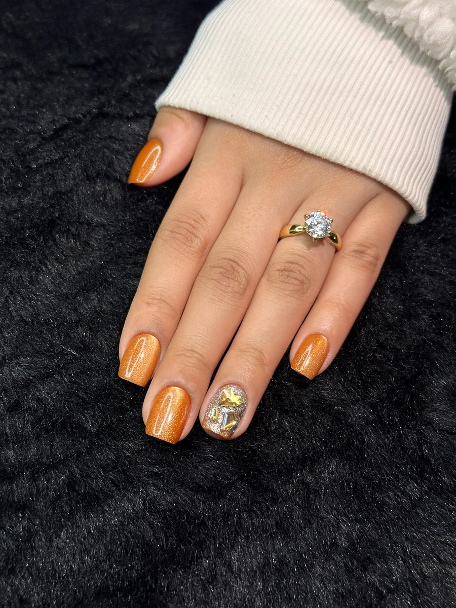 Close-up of Ambre amber shimmer square press on nails