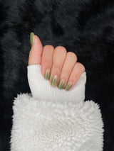 Bérénice olive shimmer square press on nails hand pose – Nailora Paris