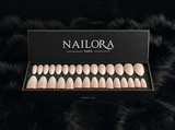 Close-up of Camille nude metallic almond press on nails