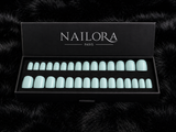 Close-up of Céleste mint green round press on nails