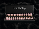 Close-up of Chloé blush pink ombré almond press on nails