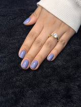 Close-up of Colette periwinkle round press on nails