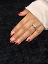 Close-up of Constance red gold french tip almond press on nails