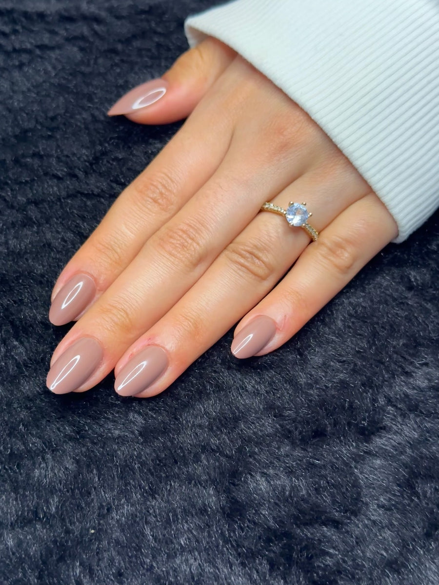 Close-up of Coralie mauve almond press on nails