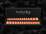 Estelle press on nails set with Nailora Paris packaging box