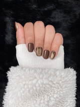 Garance chocolate brown gold glitter square press on nails hand pose – Nailora Paris