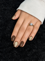 Close-up of Garance chocolate brown gold glitter square press on nails
