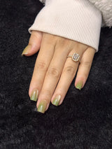Close-up of Isaure olive shimmer square press on nails