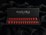 Close-up of Mathilde deep red chrome square press on nails
