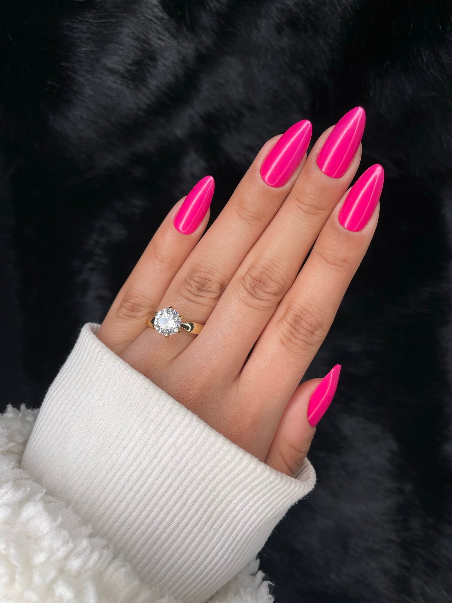 Hibiscus hot pink long almond press-on nails on hand — Nailora Paris
