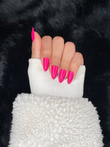 Hibiscus neon pink long almond nails closed fist view — Nailora Paris
