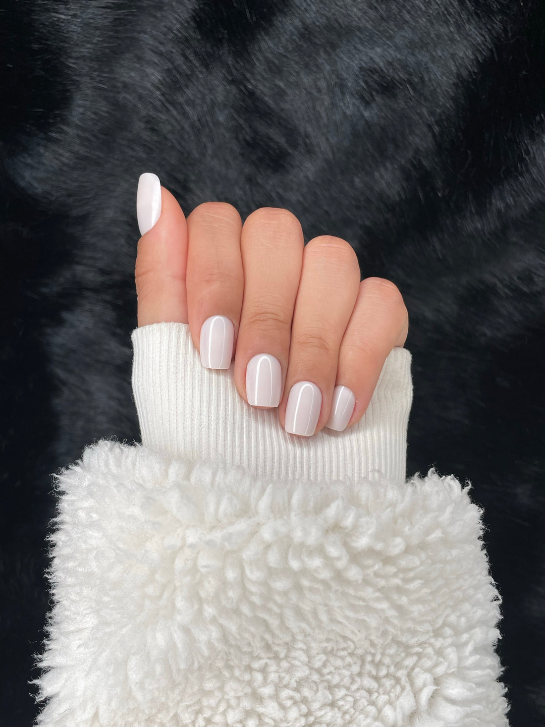 Lait off-white square press-on nails closed fist view — Nailora Paris