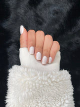 Lait off-white square press-on nails closed fist view — Nailora Paris