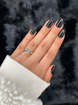 Onyx black square press-on nails on hand — Nailora Paris