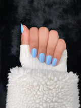Pervenche baby blue almond nails closed fist view — Nailora Paris