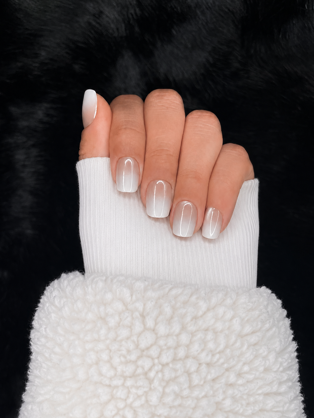 Close-up of Ophélie milky white chrome ombré square press on nails