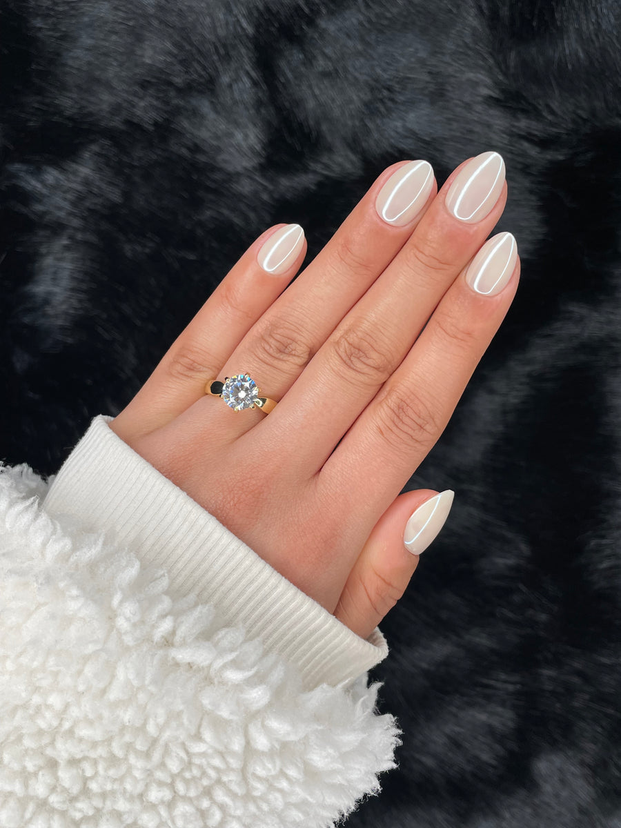 Élise extra short almond white metallic press on nails on hand – Nailora Paris