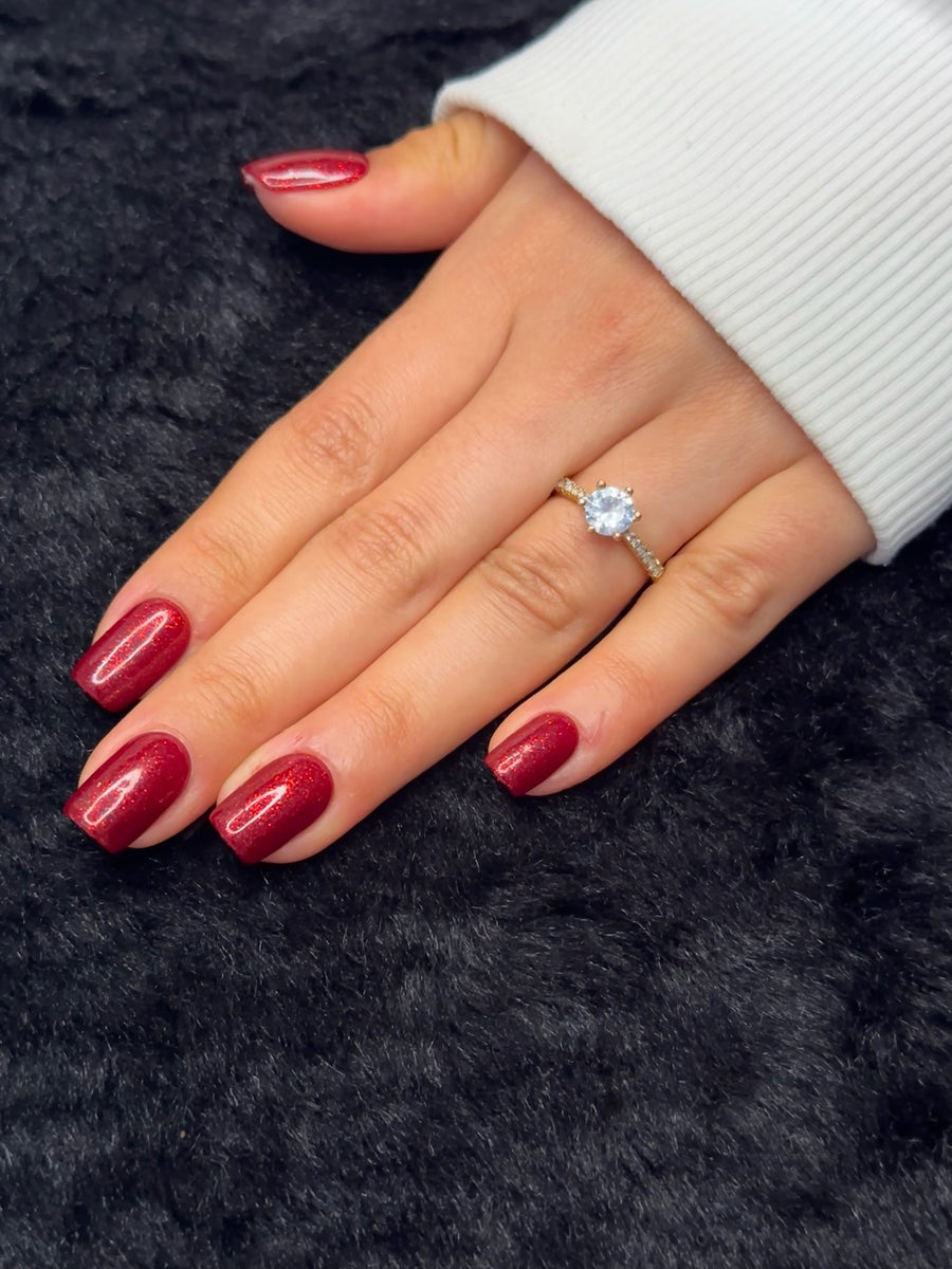 Close-up of Raphaëlle ruby red glitter square press on nails