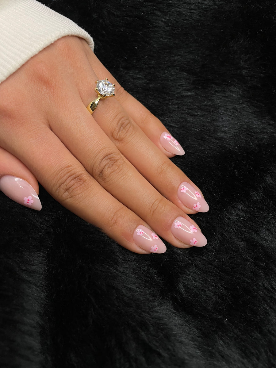 Close-up of Solange nude floral almond press on nails