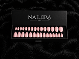 Close-up of Sophie nude pink almond press on nails