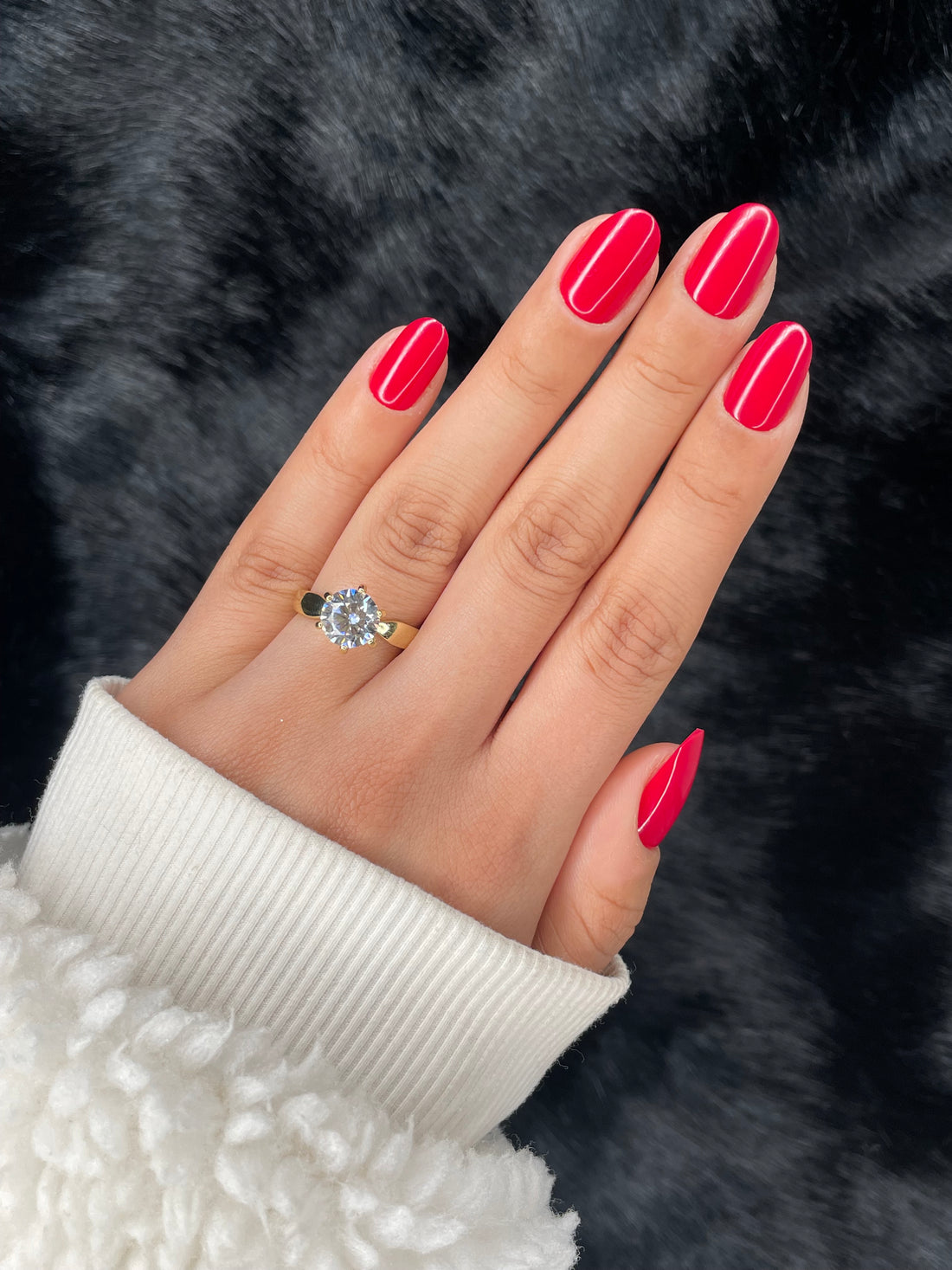 Valentine cherry red medium round press on nails worn on hand with diamond ring