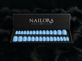 Close-up of Yasmine sky blue almond press on nails